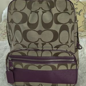 Tan and purple Coach backpack